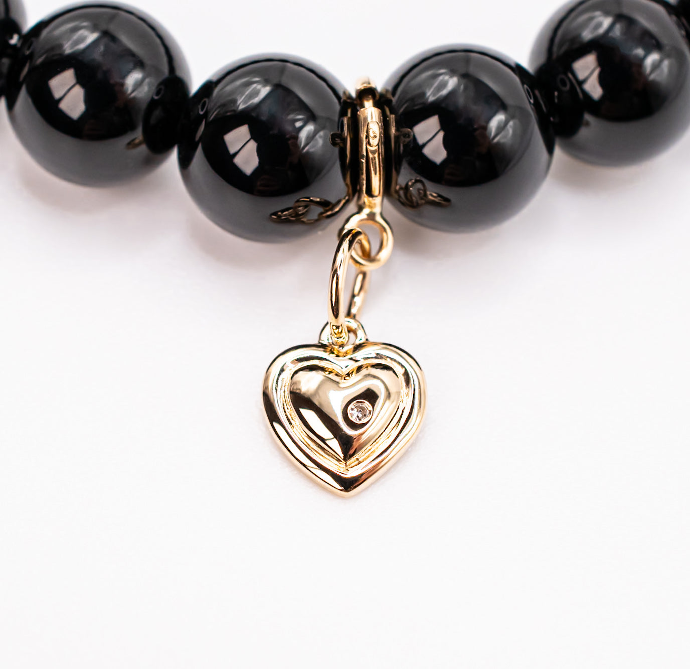 14K Yellow Gold and Diamond Puffy Heart on Black Onyx