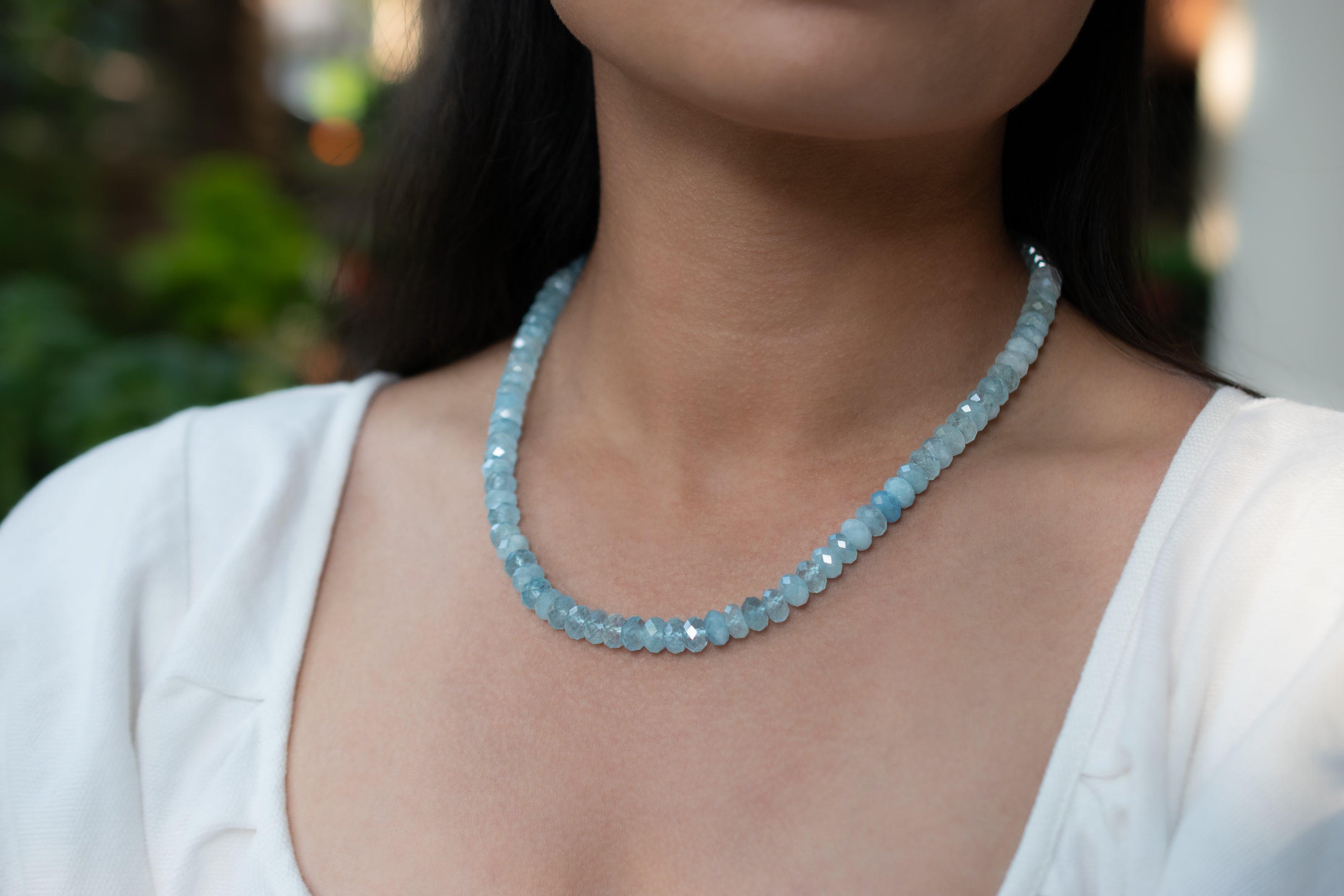 Shiny faceted Aquamarine rondelle necklace on model