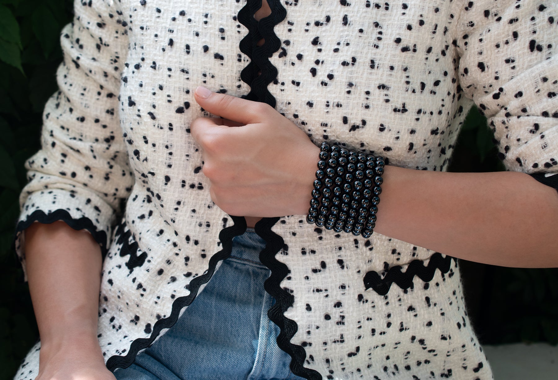 Stunning stack of black onyx beaded stretch bracelets on model